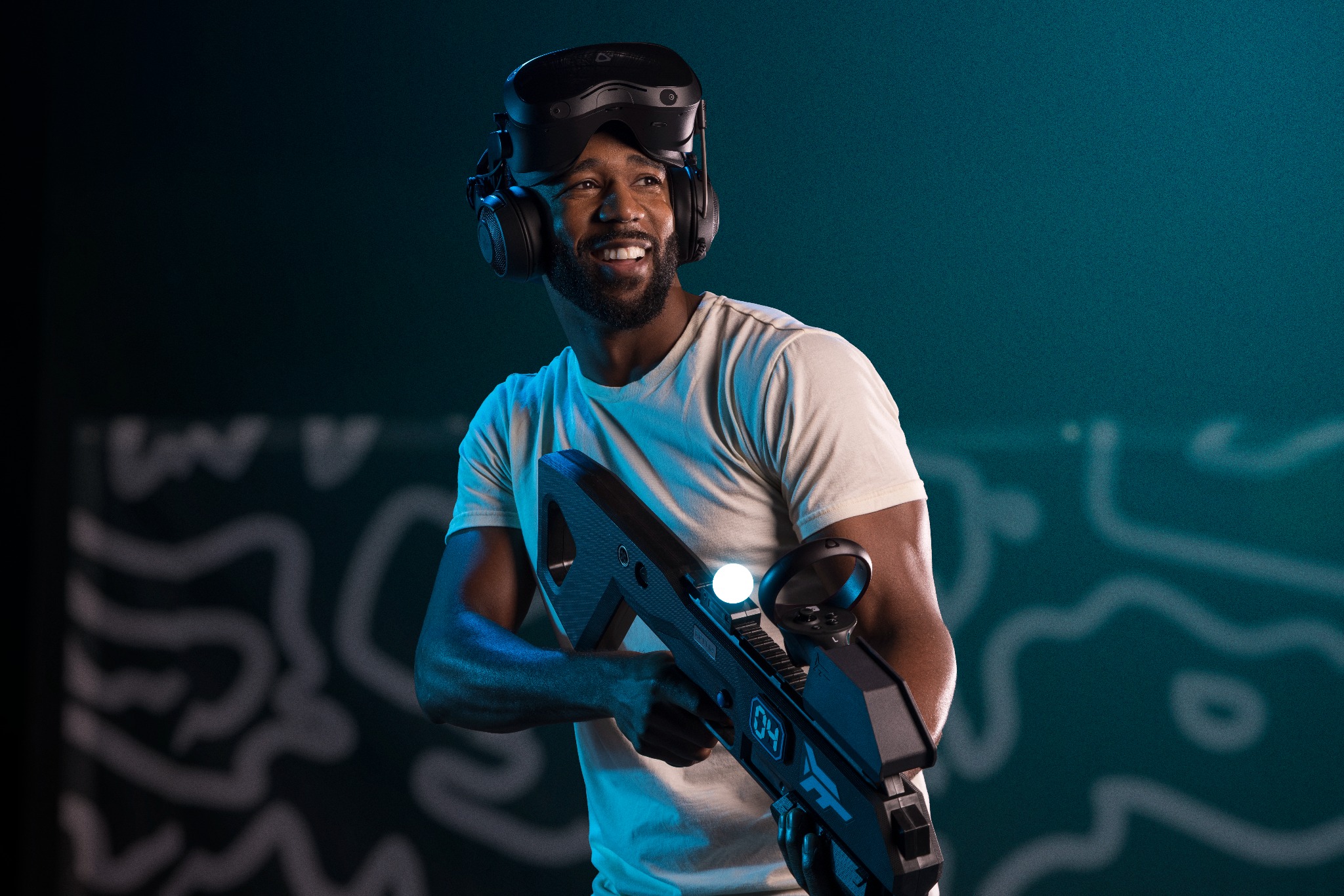 Zero Latency VR player smiling with headset and controller